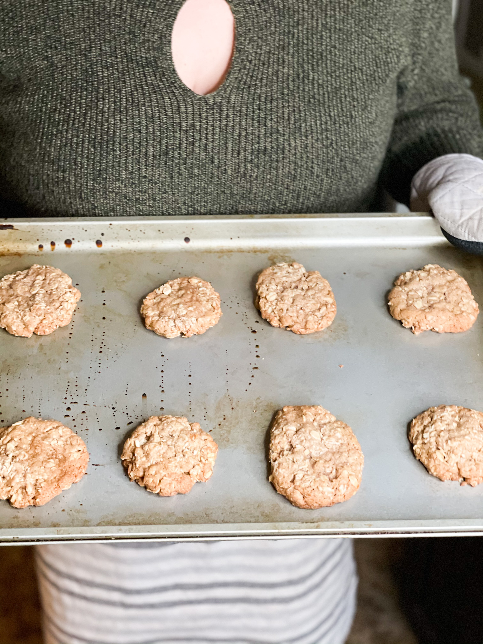 oatmeal cookies being baked on a pan being held by me 