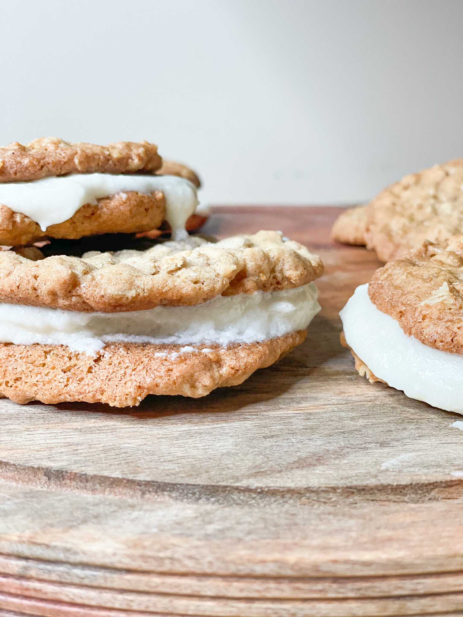 oatmeal creme pies on a wooden stand