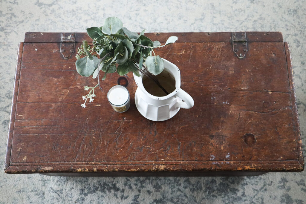 Antique chest in living room with vase 