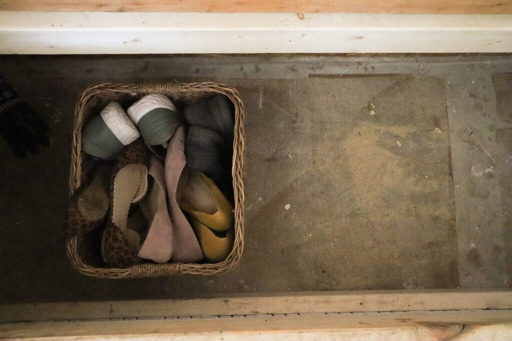 basket of shoes in a bench 